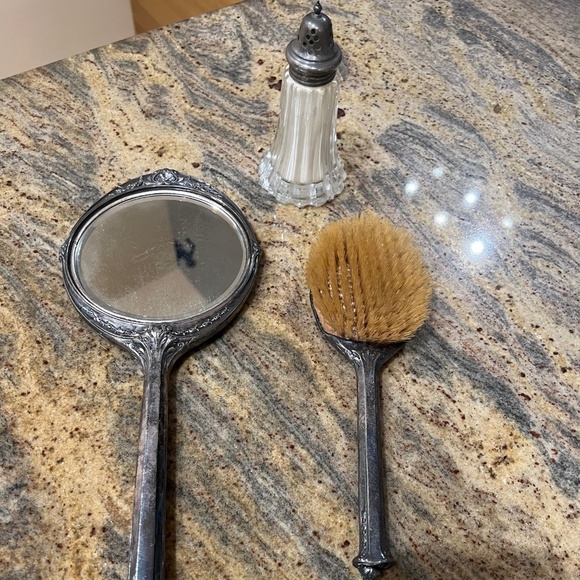 Antique silver vanity set: hairbrush, mirror, powder shaker